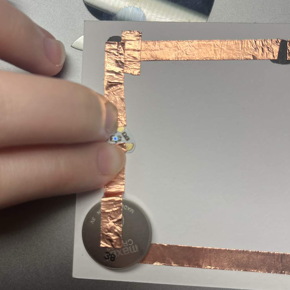 Making test of low voltage electricity by having graphite to connect the electricity and light working.